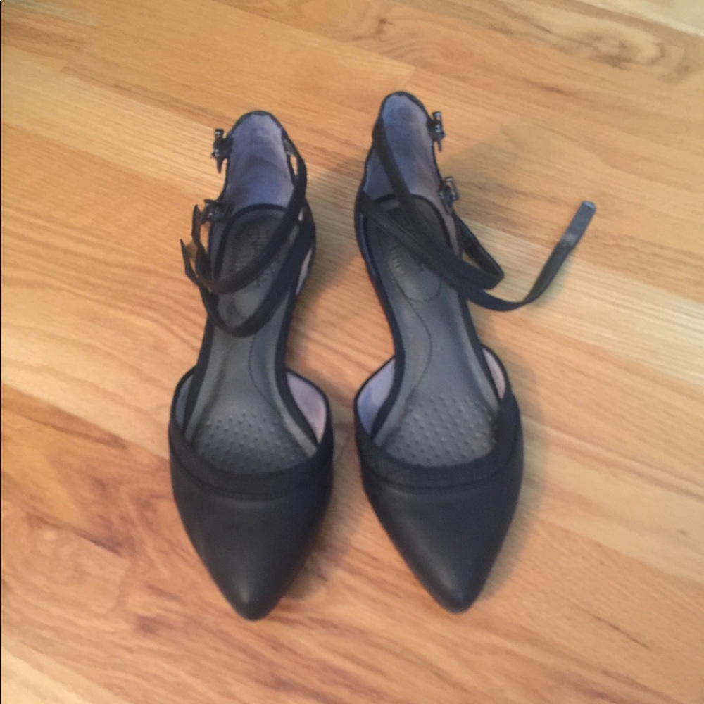 Black flats with straps around the ankle